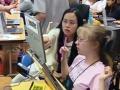 still image from video Equal Access Universal Design in Instruction showing two female DO-IT Scholars using assistive technology at a laptop computer