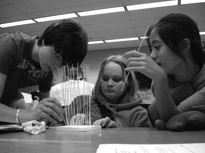 Picture of Scholars building a water tower made of spaghetti.