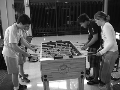 Picture of Scholars playing foosball.