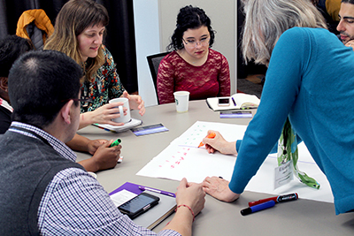 Faculty and staff brainstorm together.