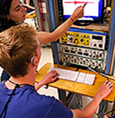 A student who is deaf works on a project in the CSNE lab