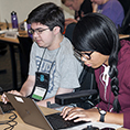 Two students working on computers.