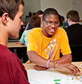 Two students with disabilities create a board game together