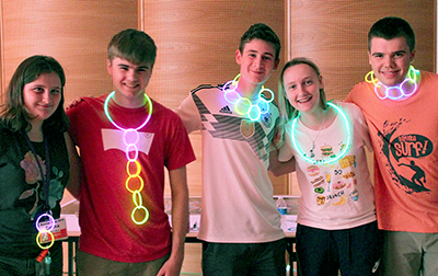 Students show off their glowing creations at the DO-IT Dance 2020.