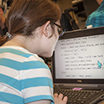 A student views large print text on a computer.