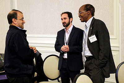 Conference participants network with each other.