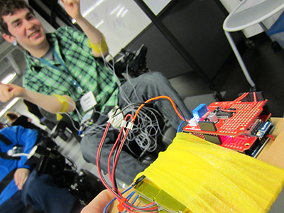 A student in a wheelchair involved in an engineering project.