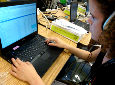 Picture of student using laptop with accessible technology.