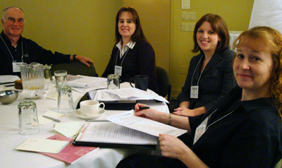 Image of four faculty members sitting at a table.