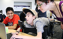 Image of students working together on a project