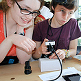 Image of two students working on a science lab