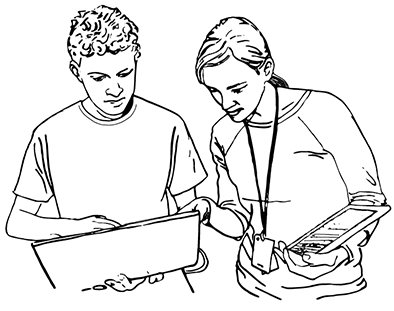 An instructor works with a student on a computer.