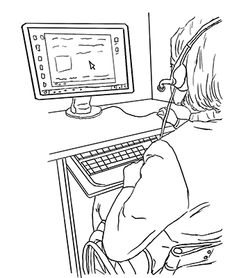 A student uses the computer while wearing a headset.